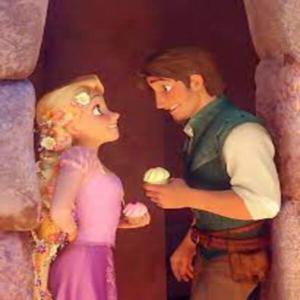 Flynn dan Rapunzel menikmati kue cake dari atas kastil dengan penuh kebahagiaan